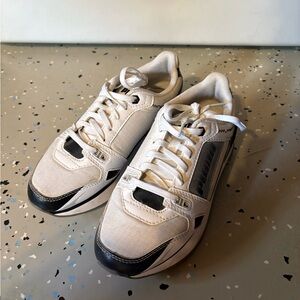 White Puma Sneakers with Black Accents